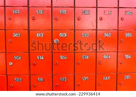 Rows of red locked post office boxes