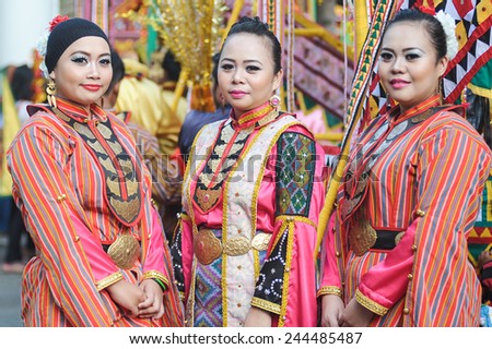 Kota Belud, Sabah Malaysia - October 18, 2014 : Iranun ladies in traditional costume pose for the camera during Usunan festival in Kota Belud Sabah, Malaysia on October 18, 2014.