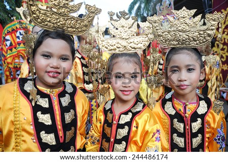 Kota Belud, Sabah Malaysia - October 18, 2014 : Bajau kids in traditional costume pose for the camera during Usunan festival on October 18, 2014 in Kota Belud Sabah, Malaysia.