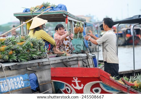 Cai Rang, Can Tho Vietnam. June 14, 2014 : Unidentified fruit sellers at the Floating Market on June 14, 2014.Cai Rang is the biggest floating market in the Mekong Delta and attraction for tourist.