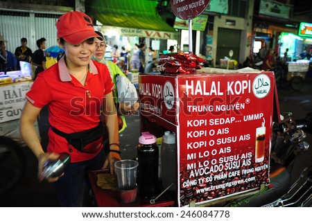 Ho Chi Minh, Vietnam - June 11, 2014.Unidentified coffee street vendor preparing coffee for her customers in Ho Chi Minh city on June 11, 2014.Coffee is number one drink across Vietnam.