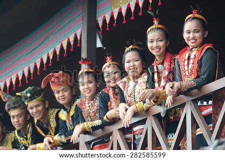 Penampang, Sabah Malaysia.May 30, 2015 : A group of people from Lotud tribe of Sabah Malaysian Borneo wearing traditional costume during Pesta Kaamatan.Image with selective focus on the ladies.