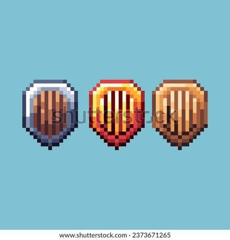 Pixel art sets of gold silver shield with variation color item asset. Simple bits of shield on pixelated style. 8bits perfect for game asset or design asset element for your game design asset.