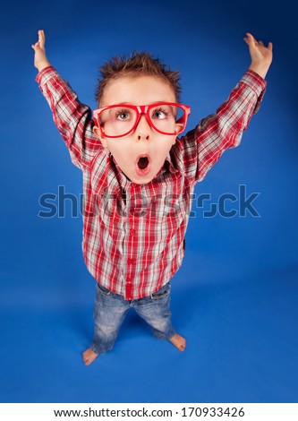 Active funny five years old boy with expressive face, jumping, playing concept