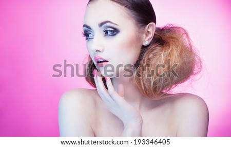 Face close up of beautiful surprised young woman with professional party make up