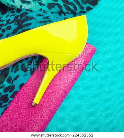 Neon high heel, dress and snakeskin print bag, woman fashion concept
