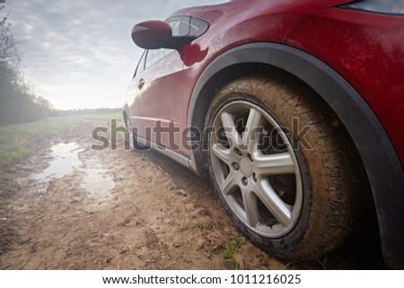 Similar – Image, Stock Photo Car riding along dirty road in evening forest