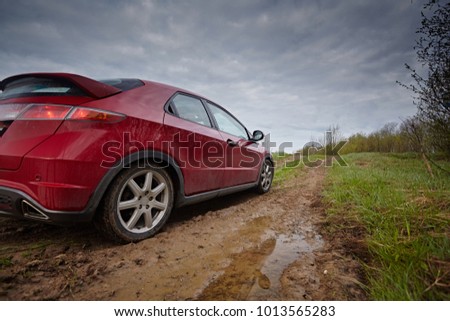 Similar – Image, Stock Photo Car riding along dirty road in evening forest