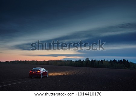 Similar – Image, Stock Photo Car riding along dirty road in evening forest