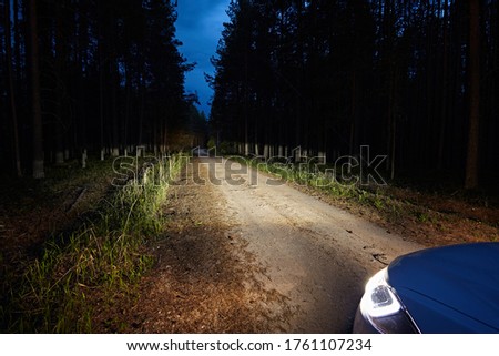 Similar – Image, Stock Photo Car riding along dirty road in evening forest