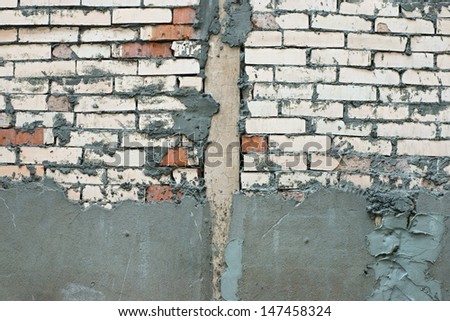 Repair of a brick wall with the subsequent plaster