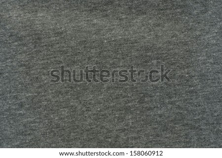 Gray texture of fabric from a textile material for an abstract background, for an empty surface and for wall-paper