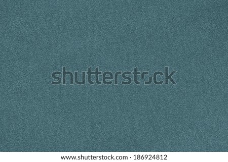 texture of cicatricial synthetic fabric of an abstract background of turquoise color