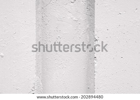 abstract relief of a hollow and ledges on a concrete wall for textural backgrounds of gray color