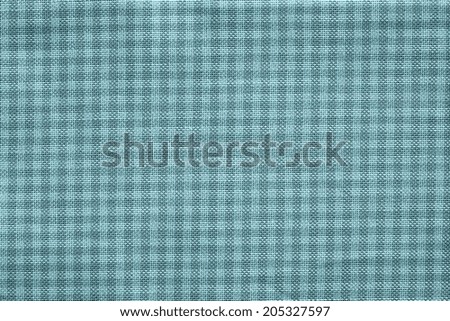 texture of textile checkered fabric of turquoise color indigo for abstract backgrounds