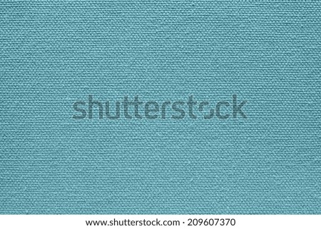 background from  textile fabric of a canvas of turquoise color with abstract texture from interlacings