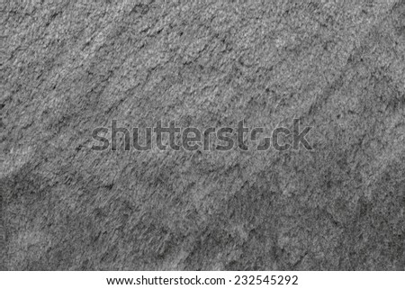 smooth fleecy texture of pure fur fabric of gray color for empty backgrounds