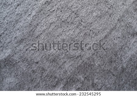 smooth fleecy texture of pure fur fabric of silvery gray color for empty backgrounds