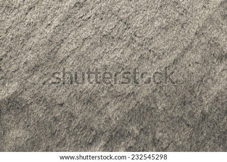 smooth fleecy texture of pure fur fabric of beige color for empty backgrounds
