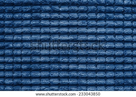 soft fluffy texture of terry checkered fabric of silvery blue color for empty and pure backgrounds