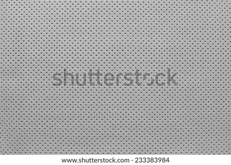 texture of leather fabric with outer side for pure backgrounds of pale gray color with the punched openings