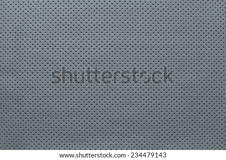 texture of leather fabric with outer side for pure backgrounds of silvery color with the punched openings