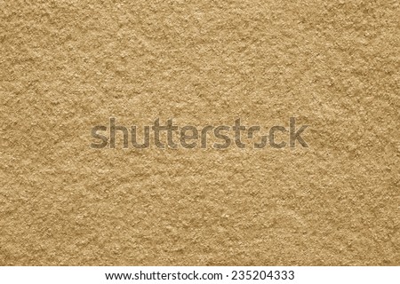 the pure textured surface of felt fabric of sand color for empty backgrounds