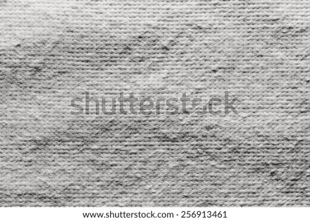 texture of quilted textile batting of gray color for pure and empty backgrounds