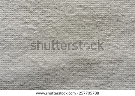 texture of quilted textile batting of gray color for pure and empty backgrounds