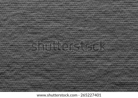 quilted abstract soft fibrous texture of textiles of black color for empty and pure wadded backgrounds