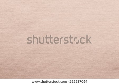small knitted abstract texture of fabric of pale pink color for empty and pure backgrounds