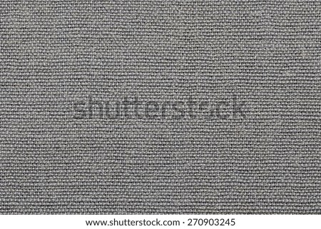 grained texture of textile rough fabric of gray color for empty and pure backgrounds