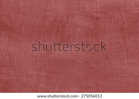 grained texture of textile fabric of pale red color for empty and pure backgrounds