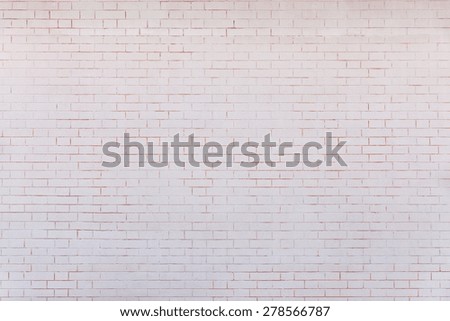 the pale pink textured surface of a brick wall for empty and pure backgrounds