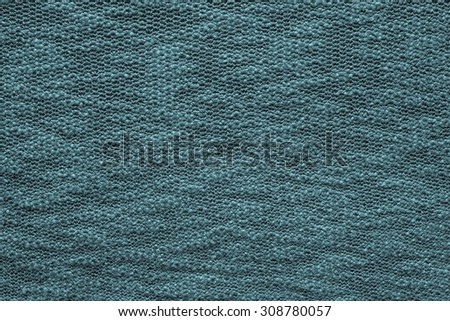 abstract texture jersey of dark blue green color closeup for backgrounds with a blank space for the text
