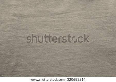 abstract texture of cotton fabric of beige color with a blank space for pure backgrounds