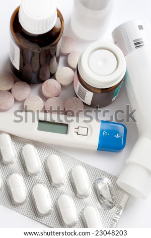 pill containers, tablets and thermometer