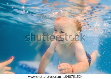 Similar – Image, Stock Photo Mother and son diving on a swimming pool