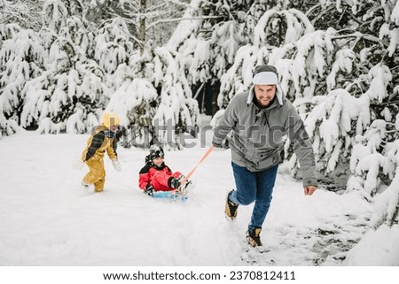 Similar – Foto Bild Junge mit rotem Schlitten im Schnee