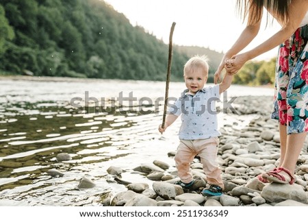 Similar – Image, Stock Photo Baby son standing on mothers feet