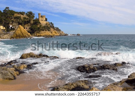 Castell d'en Plajan on the Costa Brava and city beach in Lloret de Mar, Spain. Sand and sea waves. Imagine de stoc © 