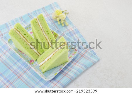 green chiffon cake on blue dish