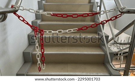 Image, Stock Photo Red white barrier chain disappears in green hedge