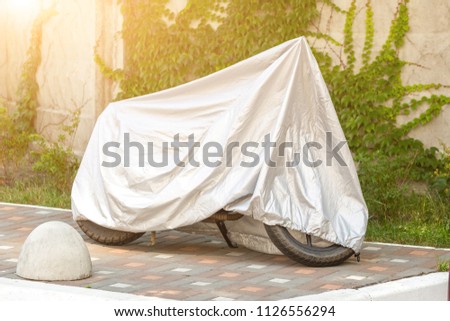 Similar – Image, Stock Photo Grey dust protection tarpaulin partially opened during facade renovation gives view of red brick masonry