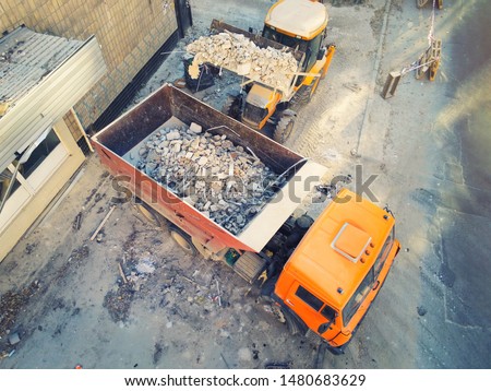 Similar – Image, Stock Photo Bucket with building rubble in front of a facade