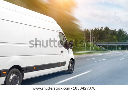 White modern delivery small shipment cargo courier van moving fast on motorway road to city urban suburb. Busines distribution and logistics express service. Mini bus driving on highway on sunny day Stock foto © 