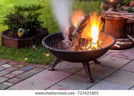 Similar – Image, Stock Photo fire in the garden	fireplace made of old metal barrel