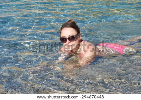woman floating on the sea