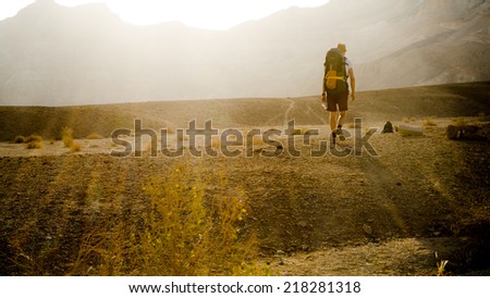 NEGEV DESERT, ISRAEL - APRIL: Hiker from Europe walking in Negev Desert on April, 2013 in Negev Desert, Israel.