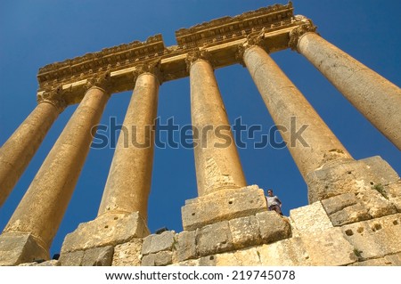 BAALBECK,LEBANON - CIRCA OCTOBER, 2012-  Tourist standing near huge column of Roman template at Baalbeck